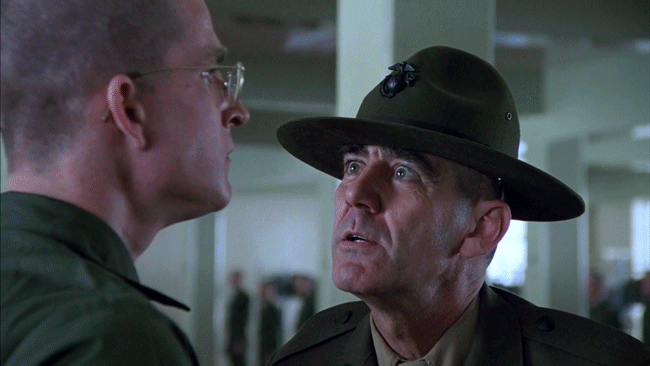 Drill sergeant glaring at a recruit